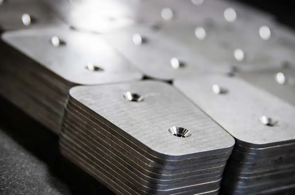 Stacked machined steel backing plates