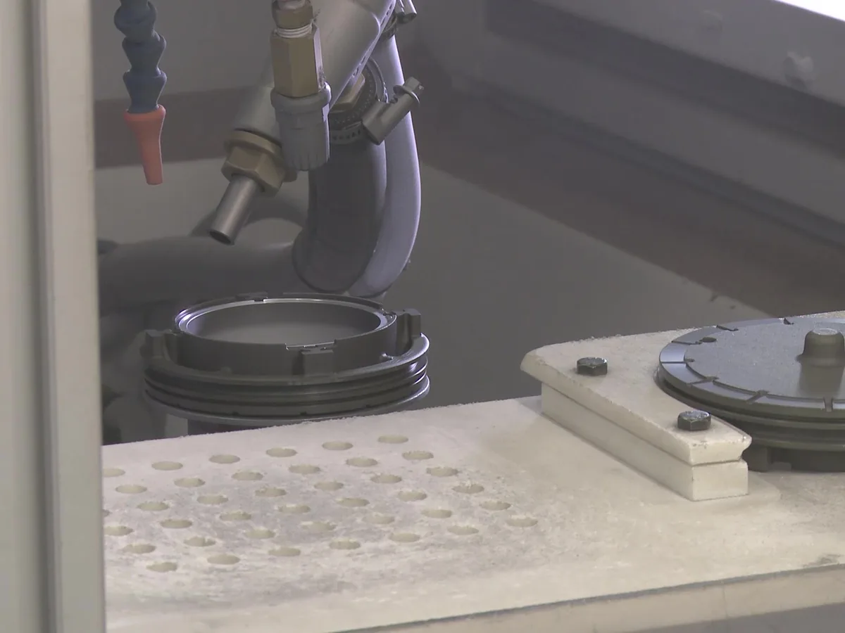 Shot blasting a component before bonding